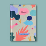 Planner with colorful abstract design on a light blue background