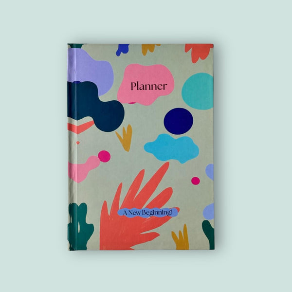 Colorful planner with abstract designs on a light gray background