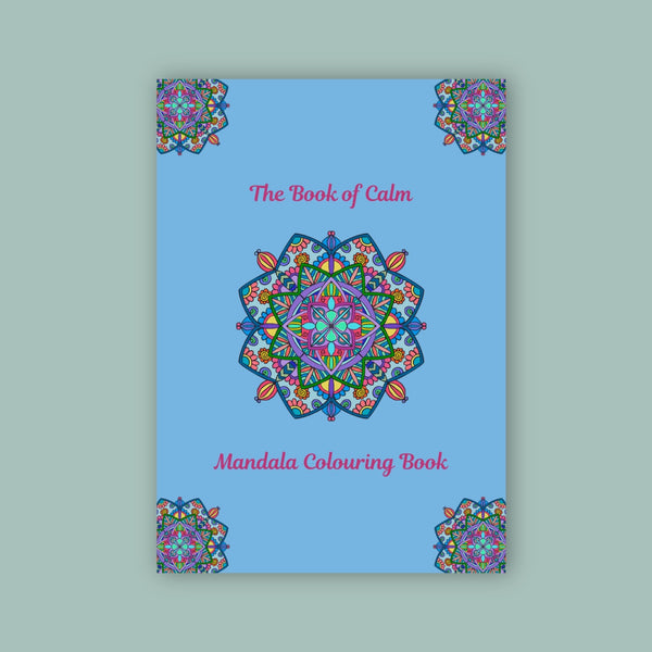 Mandala coloring book with colorful design on a blue cover against a light green background