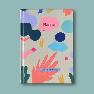 Planner with colorful abstract design on a light blue background