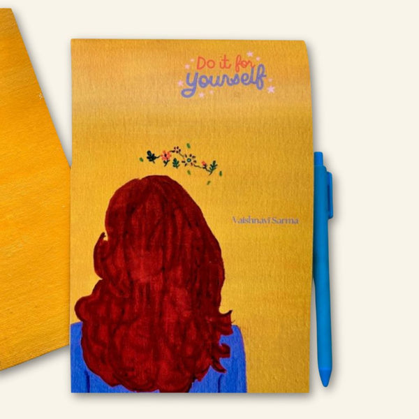 Notebook with a red-haired person illustration and 'Do it for yourself' text on a yellow background.