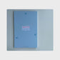 product overview of the small step everyday task organizer. The cover is blue in colour with light blue inner pages.